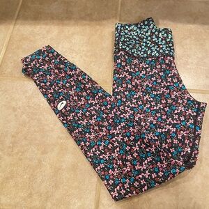 Nike XS. Dri-Fit running tights in a fun floral pattern
